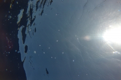 Mirror of sunlight on the surface above