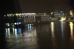 Window into lights on water at night