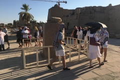 Window into people walking seven times around Scarab